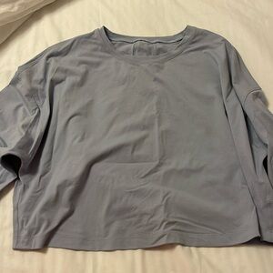 Cropped long sleeve powder blue Lululemon shirt